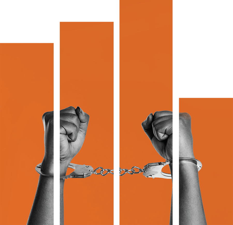 handcuffed arms in front of orange bar graphs